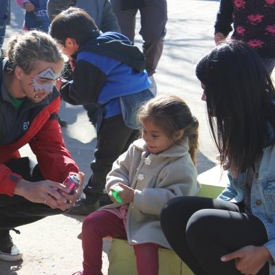 Projects Abroad Childcare volunteers talk with a child at a community outreach in Argentina. Projects Abroad volunteers interact with a child in Argentina during a community day at a local care centre.